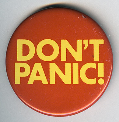 A lapel pin from the Hichhiker’s Guide to the Galaxy reading “Don’t Panic”.